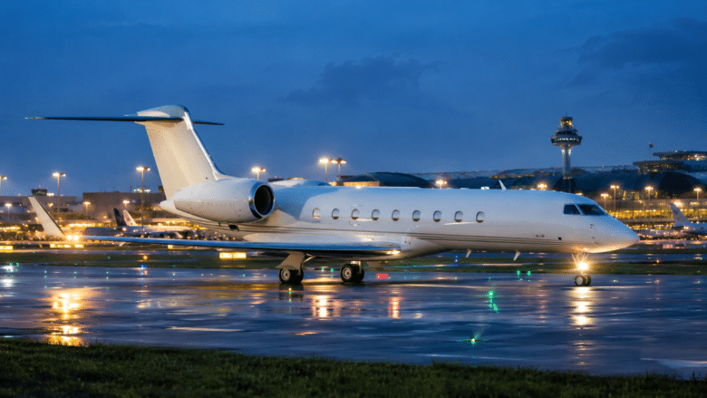 Private jet on the apron at Singapore Changi Airport at dusk